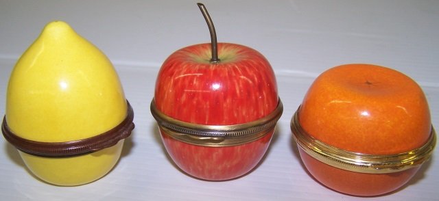 *3 PORCELAIN TRINKET BOXES: Halcyon Days, orange, approximate height 1 1/4", lemon, height 2, apple, height 2 1/4".