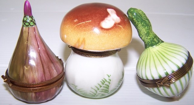 *3 LIMOGES PORCELAIN TRINKET BOXES: Mushroom, approximate height 2 1/4", onion, approximate height 2 3/4" and onion, approximate height 2 1/2".