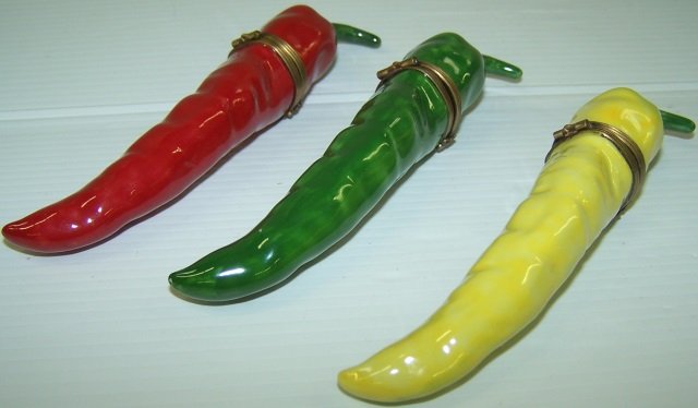 *3 LIMOGES PORCELAIN TRINKET BOXES: Red, yellow and green peppers, approximate length 5 1/4".