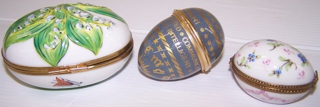 *3 PORCELAIN TRINKET BOXES: Egg shaped, longest approximate length 3 1/4".
