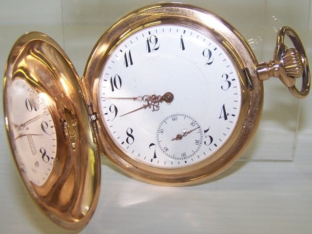 *SWISS 14K YELLOW GOLD POCKET WATCH: Having jeweled movement, stem wound, lever set with Arabic numeral markers and second subsidiary on white finish dial, contained in 14k yellow gold hunter case, approximate weight 67.3dwt.