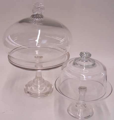 *2 MOLDED GLASS CAKE STANDS: With domes, approximate height 9" and 15".