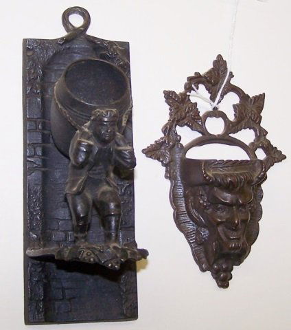 *2 CAST IRON MATCH POCKETS: Bacchus and man carrying barrel, approximate height 6" and 7 3/4".