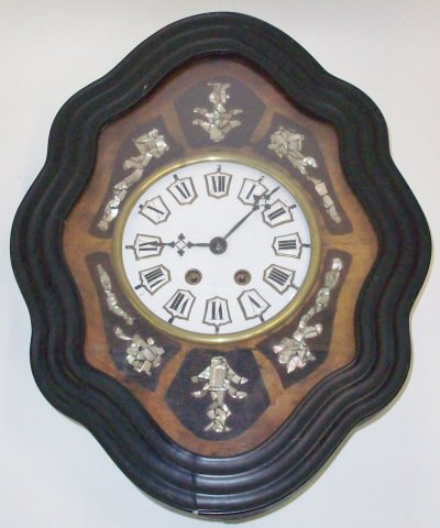 *19TH C. FRENCH WALL CLOCK: Fitted with time and strike movement, the enamel dial having porcelain numeral markers, enclosed in ebony case with mother of pearl inlay.