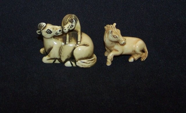 *2 IVORY NETSUKES: Recumbent horse and recumbent horse and fawn, approximate height on tallest 1". Note: Items containing ivory will only be shipped domestically and cannot be shipped to California.