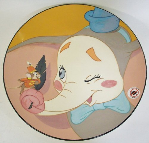*ELISABETE GOMES CERAMIC DUMBO CHARGER: Depicting Dumbo and Timothy Mouse, signed on underside, limited edition 7/60, includes sealed COA, approximate diameter 17".