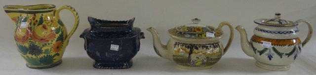 *4 PIECES: 19th C. flow blue sugar decorated with landscape, approximate height 5 1/2", Italian polychrome pitcher having floral decoration on yellow ground, height 6 3/4", polychrome teapot having leaf decorati