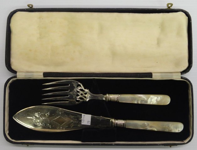 *2 PIECE FISH SET: Fork and knife with engraved scroll decoration and mother-of-pearl handles, enclosed in fitted case.