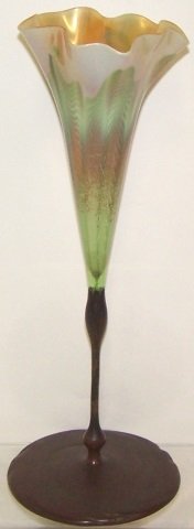 *TIFFANY BRONZE AND ART GLASS VASE: Having iridescent glass, flora form vase with bronze base marked twice "Tiffany Studios, New York" and Tiffany Glass and Decorating Company "TGD&Co", having impressed 27040, approximate height 15 1/4"
