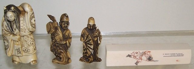 *4 PIECES OF CARVED IVORY: 3 netsukes,1 with revolving head, approximate height 3", 1 with fan, height 2 1/4" and 1 with fish, height 2 1/4", and stamp decorated with Oriental figure, height 3 3/4". Note: Items containing ivory