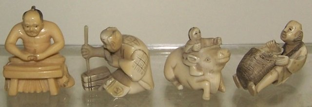 4 CARVED IVORY NETSUKES: Gentleman at table, woman on water buffalo, gentleman pouring grain, etc., signed, approximate height of tallest 1 3/4". Note: Items containing ivory will only be shipped domestically and cannot be sh