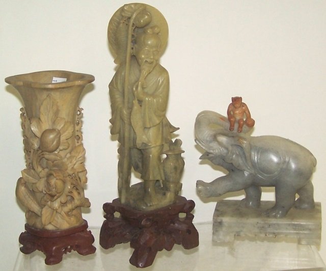 3 PIECES OF CARVED SOAPSTONE: Figure of bearded gentleman, vase with floral decoration and monkey atop elephant, height of tallest 10".