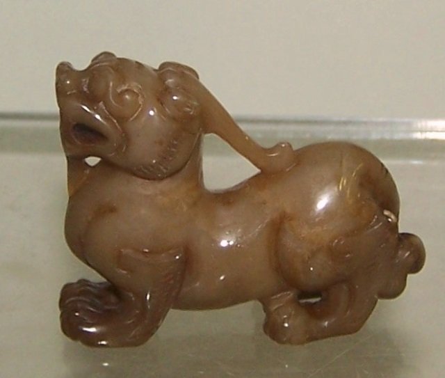 *CARVED JADE SCULPTURE: Foo dog, approximate height 1 3/4"