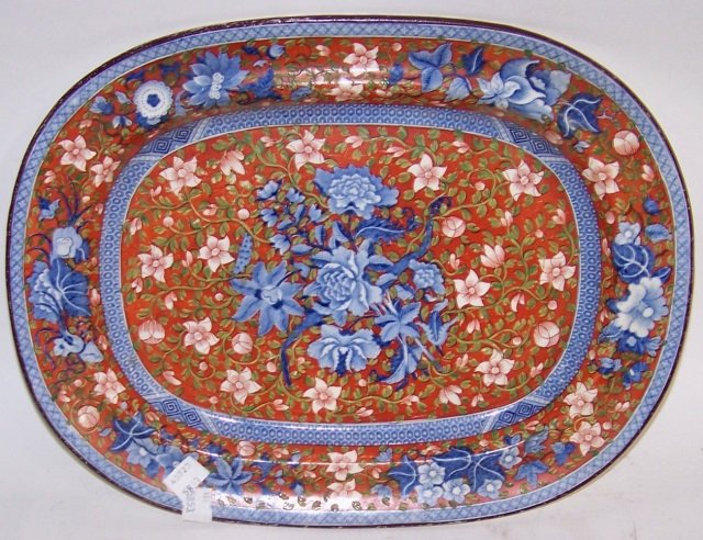 *19TH C. ENGLISH IRONSTONE PLATTER: Having oval form and Oriental style floral design in rust and blue, approximate length 14 3/4".