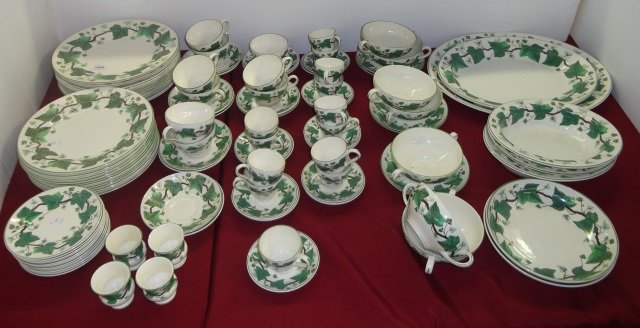 *SET OF WEDGWOOD DINNERWARE: "Napoleon Ivy" pattern, 11 dinner plates, 11 salad plates, 13 demitasse cups, 13 saucers, 9 coffee cups, 12 saucers, 5 bouillon cups, 5 saucers, 3 oval bowls, 2 oval platters and 4 egg cups.