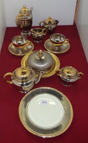 *SET OF WEDGWOOD DINNERWARE: Having silver and gilt finish, Edme coffee server, tea server, covered butter, 2 creamers, covered sugar, 2 teacups, 2 saucers, and 2 dessert plates.