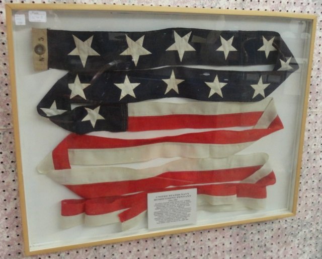 *US NAVY HOMECOMING PENNANT: Displayed in shadow box frame, ca. 1890 flown from the main by a ship continuously on duty for 9 months or more. It remains displayed until sunset of a day of arrival home. Traditionally the blue port