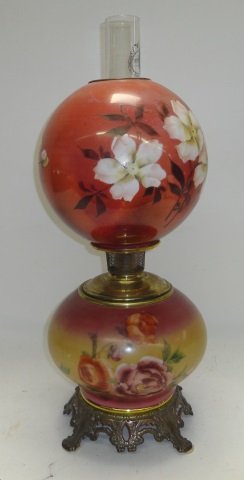 *GONE WITH THE WIND STYLE OIL LAMP: Having handpainted floral decoration on globes and brass hardware, approximate height with chimney 25".