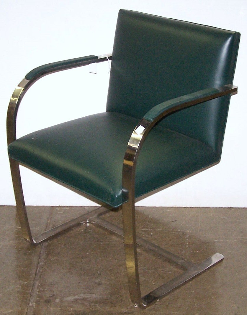 *MIES VAN DER ROHE BRNO ARMCHAIR BY KNOLL: Having teal leather upholstered back, seat and armrests, having chrome frame labeled on underside "Sold by Treitel-Gratz Co.", approximate height 31 3/4", width 23", depth 22".