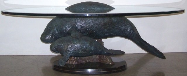 *WYLAND, ROBERT: "Above and Below Manatees", bronze and glass sculpture/coffee table, signed and numbered AP 1/95 approximate height to top of glass 20", to top of hump 22 1/4", length 61", depth 41"