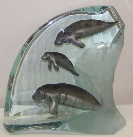 *WYLAND, ROBERT: "Manatee Tribe" lucite and pewter sculpture, signed and numbered AP, approximate height 11 1/2", width 12", depth 6".