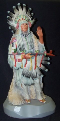 *CYBIS PORCELAIN FIGURE: Indian chief with peace pipe, signed "Cybis USA #193", raised on gray wood base, approximate figure height 16 1/4", with base 18 1/4". D3