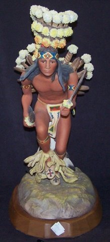 *CYBIS PORCELAIN FIGURE: Indian warrior with feather and floral headdress, signed "Cybis #30", raised on wood base, approximate figure height 17 1/2", with base 19". D3