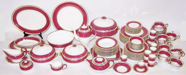 *SET OF WEDGWOOD DINNERWARE: "Ulander Powder Ruby" pattern, 12 dinner plates, 12 salad plates, 11 bread and butters, 12 soup bowls, 11 fruit bowls, 12 demitasse cups and 12 saucers, 18 coffee cups and 17 saucers, covered soup tur