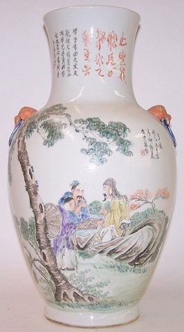 *ORIENTAL PORCELAIN VASE: Having applied Foo dogs and painted images depicting figures playing board games, approximate height 16". D3