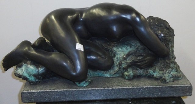 *TAINTOR, JONATHAN: Bronze sculpture, nude female laying down on earth form base, signed, dated '88 and numbered 8/15, attached to rectangular marble base, approximate height 8 3/4", length 18", depth 9 3/8".