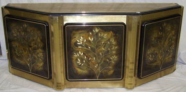 *MASTERCRAFT SIDEBOARD: Having brass and ebony finish, fitted with 3 doors with floral decoration, approximate height 30 1/4", width 75 1/2", depth 18 1/2".