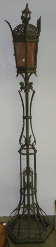 GOTHIC REVIVAL WROUGHT IRON TORCHERE LAMP: With hexagonal shade fitted with slag glass panels, cast iron, electrified, needs to be rewired, approximate height 88".