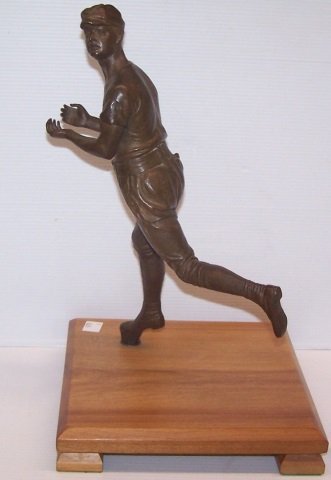 *KIRKE BUSH-BROWN, HENRY: Bronze sculpture, Baseball player, approximate height 12 1/4", with wooden base 13 3/4".