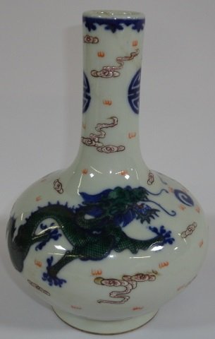 *ORIENTAL PORCELAIN VASE: Decorated with dragons, bearing 6 character mark on underside, approximate height 8 1/4".