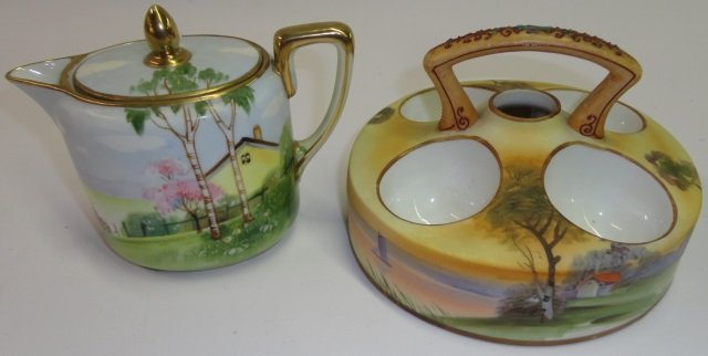 *2 PIECES OF NORITAKE PORCELAIN: Egg server fitted with single handle and having landscape decoration, approximate height 4 1/4", and a creamer decorated with pasture, height 4 /2".