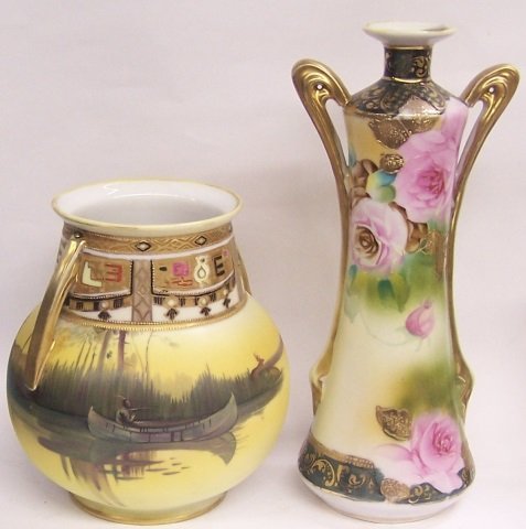 *2 HANDPAINTED NIPPON PORCELAIN VASES: 1 decorated with landscape and Native American in canoe, approximate height 7", the other having floral decoration, height 10 1/2".