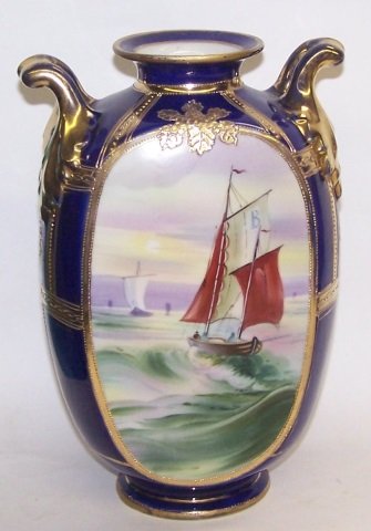 *HANDPAINTED NIPPON PORCELAIN VASE: Decorated with boats, approximate height 9".