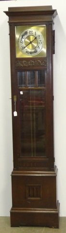 *20TH C. GERMAN LONGCASE CLOCK: Fitted with time and strike movement, the silvered metal dial having Arabic numeral markers enclosed in oak case, approximate height 89", width 20 1/2", depth 10 1/2".
