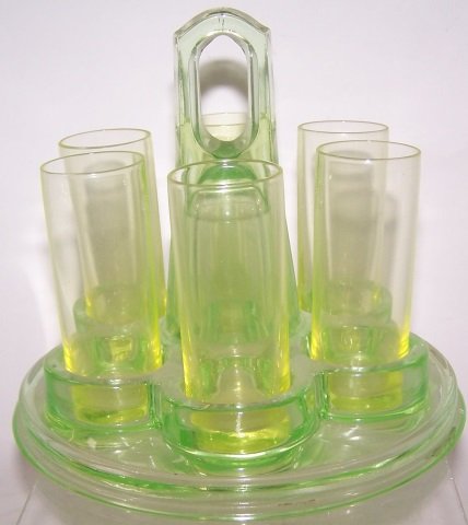 *6 VASELINE GLASS SHOT GLASSES: With carrier, approximate height 4 1/2".
