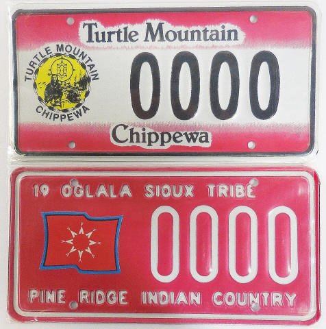 *2 NORTH DAKOTA SAMPLE PLATES: "Oglala Sioux Tribe, Pine Ridge Indian Country" and "Turtle Mountain Chippewa".