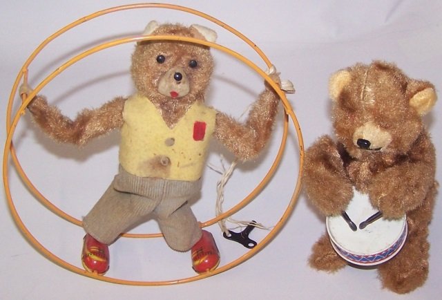 *2 WIND-UP TOYS: Bear with drum and bear in wheel.