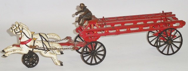 *CAST IRON 2-HORSE DRAWN LADDER WAGON: Unmarked, possibly Harris, red painted wagon with black spoke wheels pulled by 2 galloping white horses, includes driver figure, approximate length 18 1/2".