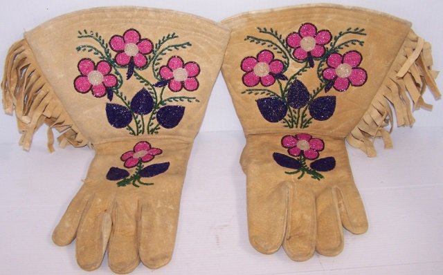 *PAIR OF NATIVE AMERICAN BEADED GAUNTLETS: With beaded floral design, approximate length 15".
