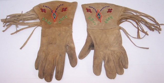 *PAIR OF WOMEN'S GAUNTLET GLOVES: Native American hide and beaded gloves with fringe, approximate length 10 1/2".