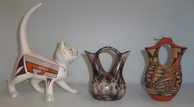 *3 PIECES OF SOUTHWEST POTTERY: 2 wedding vases, 1 having geometric design, 1 signed "M. Naq. Jemez", and a figure of a cat with geometric design, signed "L.L. Acoma", approximate height of tallest 8 5/8".