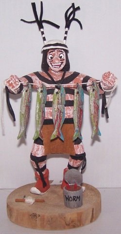 *CARVED AND PAINTED WOOD KACHINA: Man holding fish, signed on bottom "Koshare Wood", approximate height 7 3/4".