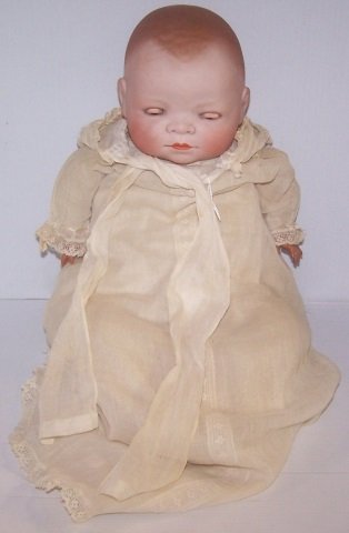 *GRACE STOREY PUTNAM BYE-LO BABY: Having sleep eyes with closed mouth, on cloth body with celluloid hands, marked on back "Copr. by Grace S. Putnam", approximate height 15", circumference of head 13 1/2".