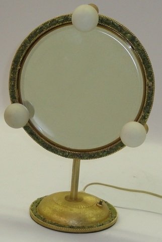 24 KARAT GOLD PLATED DRESSING MIRROR: Decorated with green crushed stone around rim and rim of base, marked on bottom "Jolle Jlrs. Int.", approximate height 14".