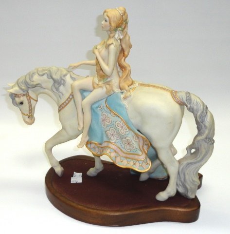 *CYBIS PORCELAIN FIGURAL GROUPING: Lady Godiva on horseback, raised on wood plinth, approximate total height 14 1/2".