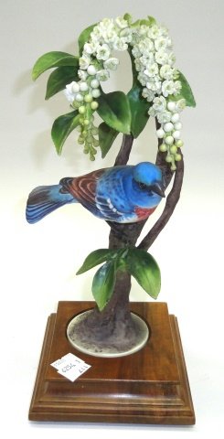 *ROYAL WORCESTER PORCELAIN FIGURAL GROUPING: "Lazuli Bunting (Passerina Amoena) with Choke Cherry", with wood stand, approximate height 11 1/2".